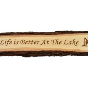 Engraved live edge door topper sign that reads, "Life is Better at the Lake".