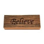 Reclaimed barn wood block sign that reads, "Believe".