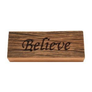 Reclaimed barn wood block sign that reads, "Believe".
