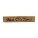 Reclaimed barn wood block sign that reads, "Bless This Home".