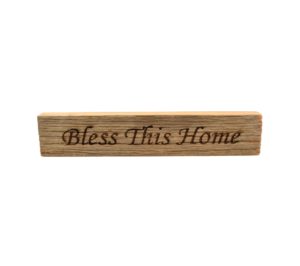 Reclaimed barn wood block sign that reads, "Bless This Home".