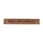 Reclaimed barn wood block sign that reads, "Don't Be Ordinary".