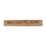 Reclaimed barn wood block sign that reads, "Don't Just Fly, SOAR".