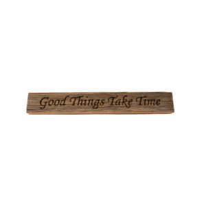 Reclaimed barn wood block sign that reads, "Good Things Take Time".