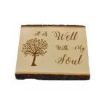 Engraved live edge sign that reads, "It Is Well With My Soul".