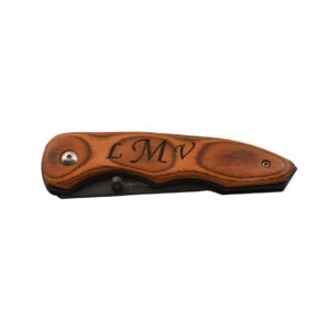 Engraved clip pocket knife.