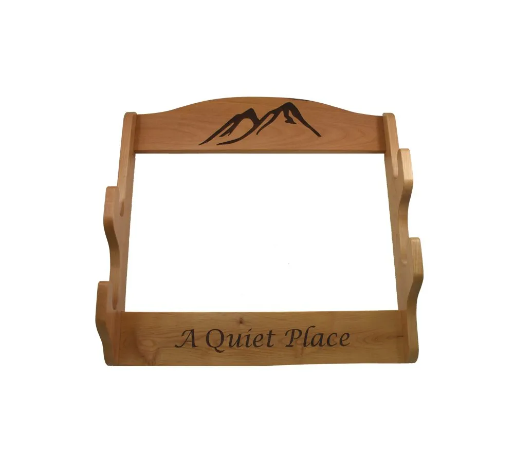 Detailed laser engraving of outdoor scene on personalized gun rack for hunters